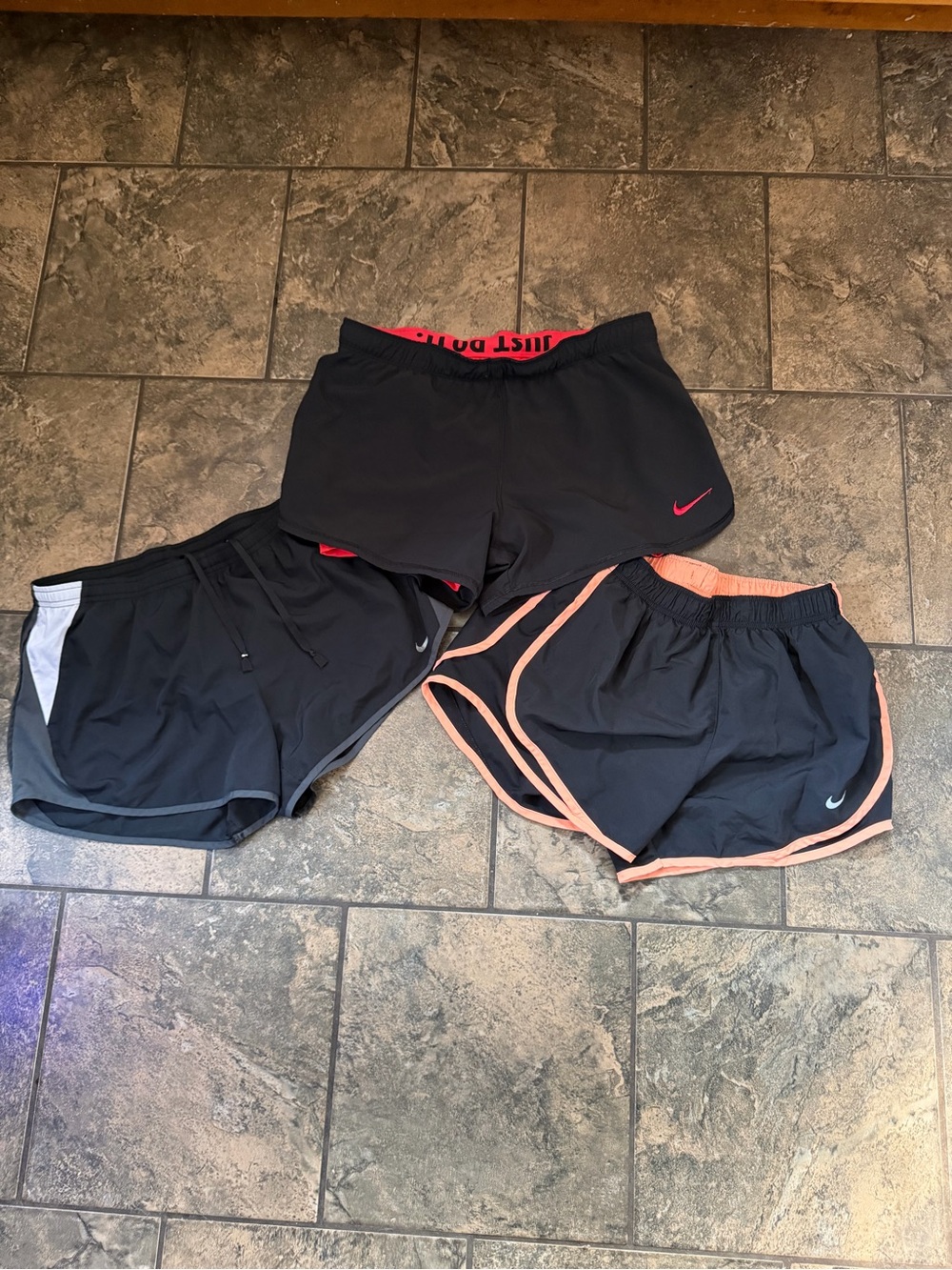 Nike Black Athletic Shorts Trio with Red and Peach Accents